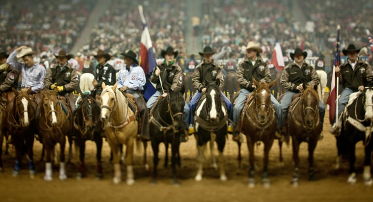 Cowboys line up before the start of the National Finals Rodeo in Las Vegas.