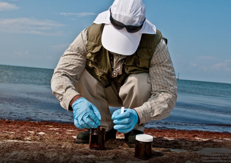Strong Bear, an environmental technician with Boston Chemical Data Corp., collects samples on Horn Island, offshore from Biloxi, Miss. Bear is part of a team of environmental investigators hired by a New Orleans law firm that has analyzed hundreds of soil, plant, water and seafood samples from the Gulf coast area affected by the BP oil spill. 