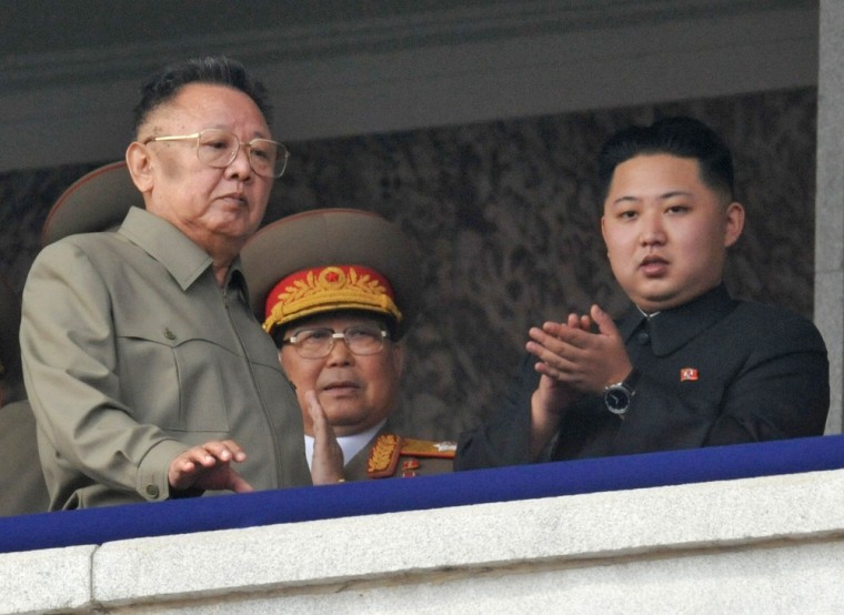 Image: North Korean leader Kim Jong-il walks in front of his youngest son Kim Jong-un as they watch a parade to commemorate the 65th anniversary of the founding of the Workers' Party of Korea in Pyongyang