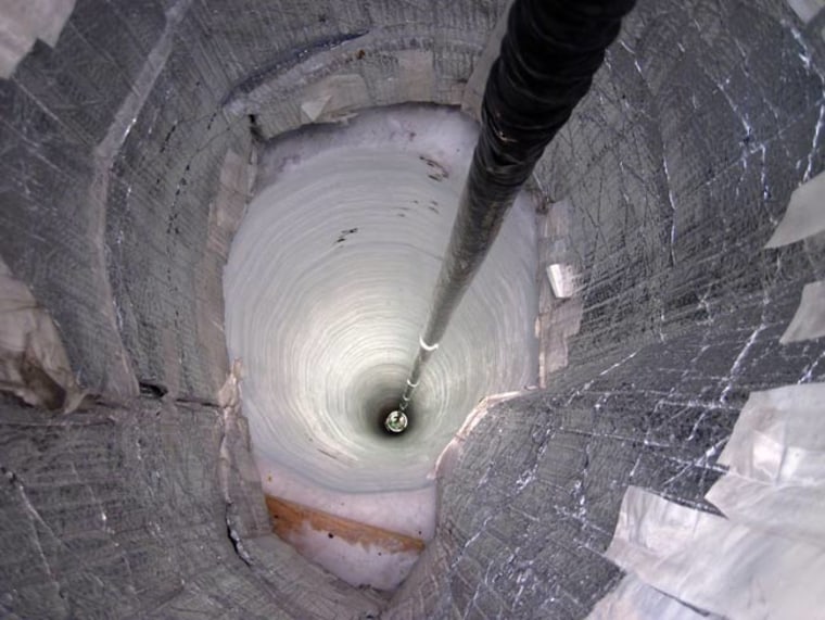 Image: Sensor descends down a hole in the ice
