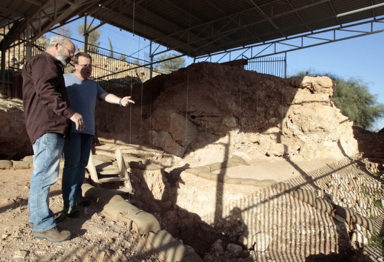 Image: Professor Avi Gopher and Dr. Ran Barkai, researchers from Tel Aviv University's Institute of Archaeology, stand at Qesem cave, an excavation site near Rosh Ha