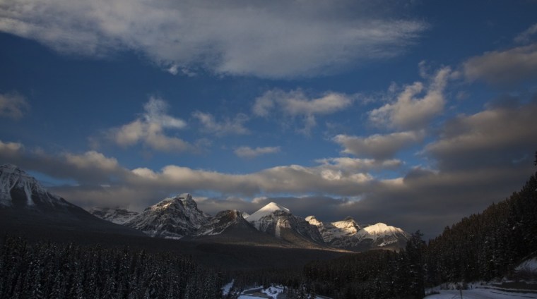 Image: A mountain range inside Banff National Park in the early morning in Lake Louise