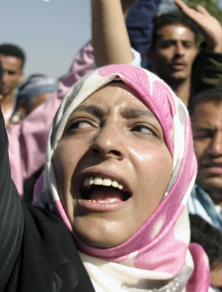 Image: Rights activist Karman shouts slogans during an anti-government rally