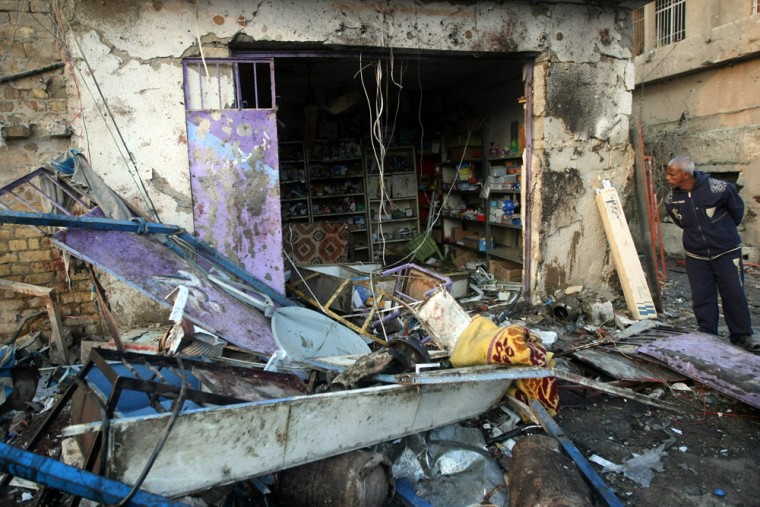 Image: A damaged store following a bombing in Baghdad