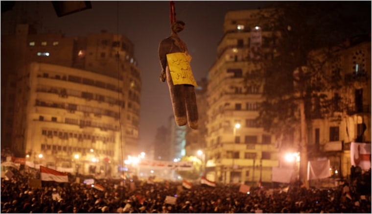 An effigy of President Hosni Mubarak hung from a traffic light in Tahrir Square in Cairo on Tuesday.