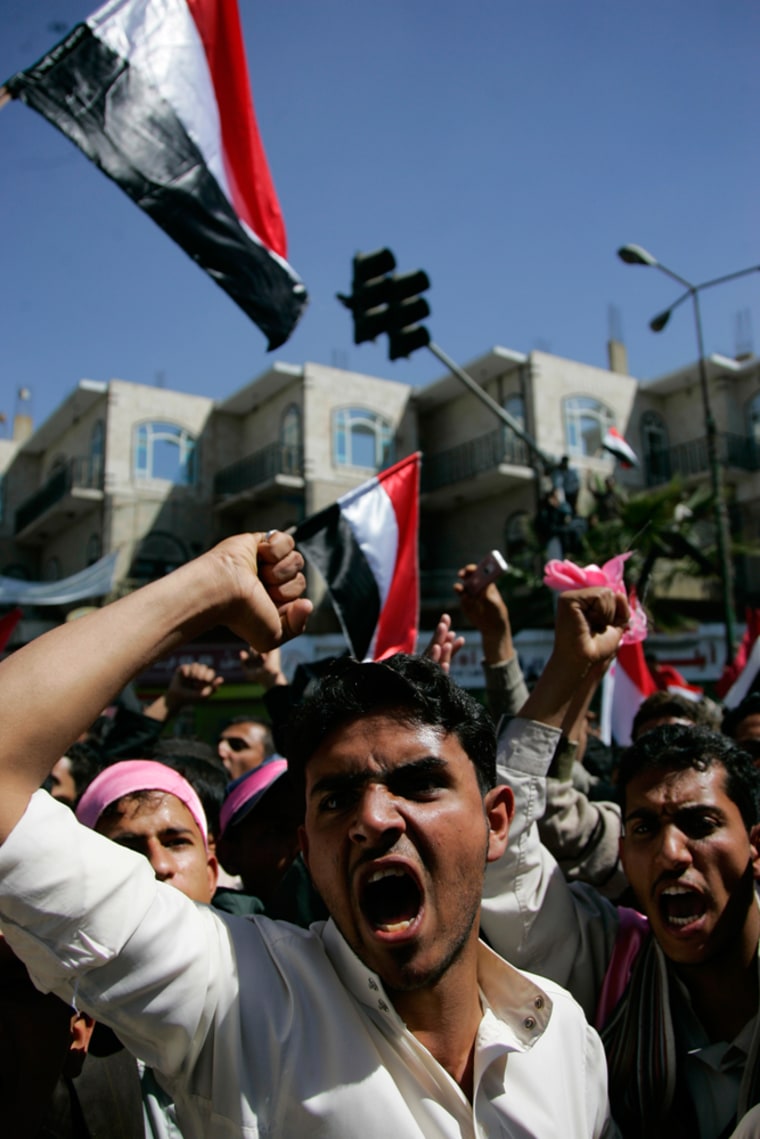Image: Opposition supporters shout slogans during an anti-government protest in Sanaa