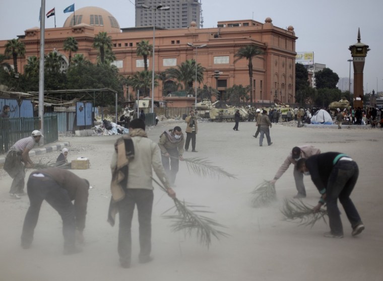 Image: Anti-government protesters clean Tahrir Square, Cairo