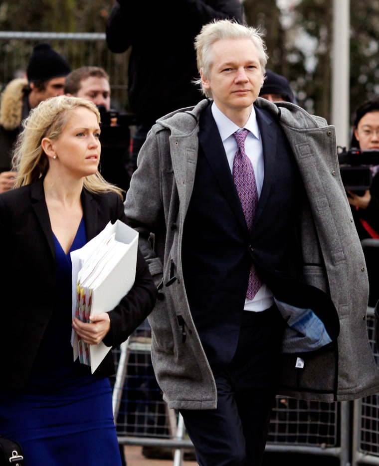 Image: Julian Assange arrives at court for an extradition hearing