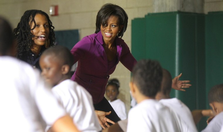 Image: First Lady Michelle Obama participates in a \"Let's Move\" after-school event in Harlem