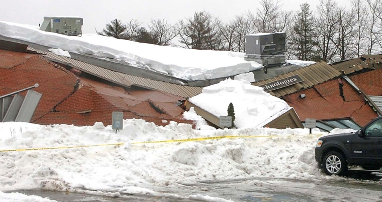 Image: The building housing Triton Technologies collapsed, Wednesday, Feb. 2, 2011, in Easton, Mass