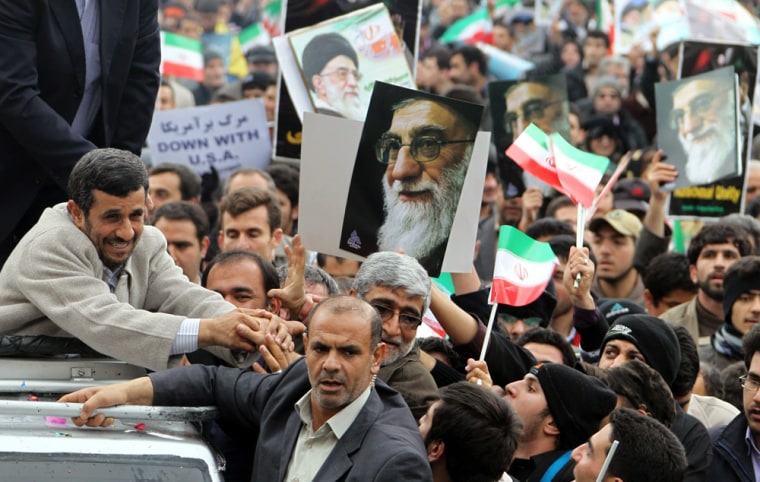 Image: Iranian President Mahmoud Ahmadinejad greets supporters