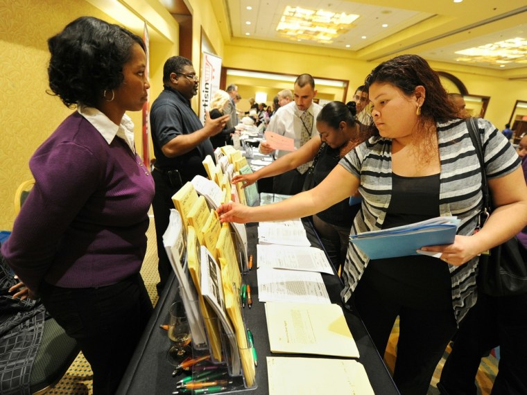 Image: Unemployed Americans pick up job applica