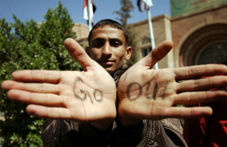 Image: An anti-regime protester shows the palms