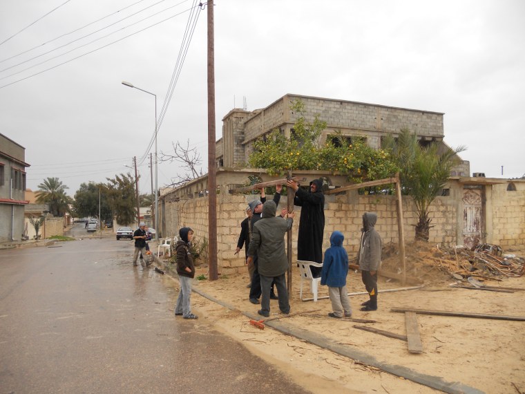 Men in Misurata set up 'neighborhood watch'-type command posts and make rounds to protect houses.