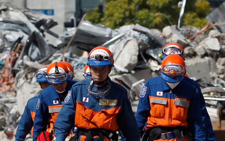 Image: Japanese rescue workers arrive at the rubble of CTV building in Christchurch