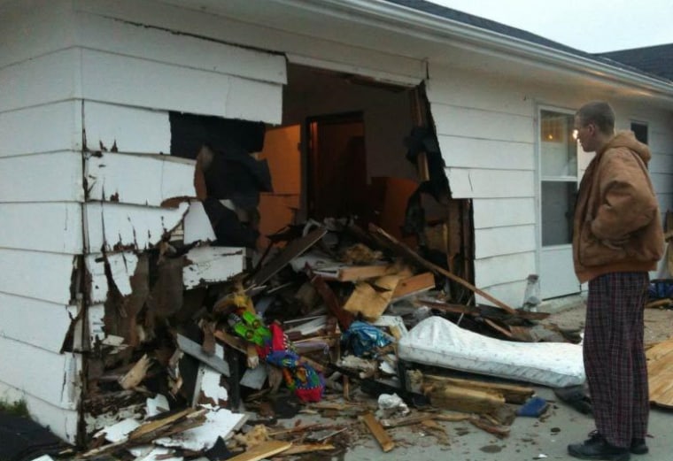 The parents say the impact of the crash shot the infant through a wall and a door frame.