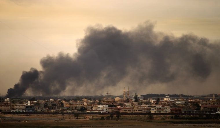 Image: Smoke billows from a Benghazi neighbourh