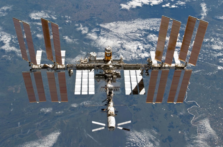 The International Space Station is shown in this image photographed by an STS-133 crew member on space shuttle Discovery after the station and shuttle began their post-undocking separation. Undocking of the two spacecraft occurred on March 7.