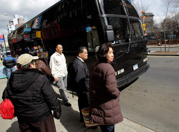 Image: Passengers in Manhattan's Chinatown neighborhood in New York wait to board a bus to the Mohegan Sun casino