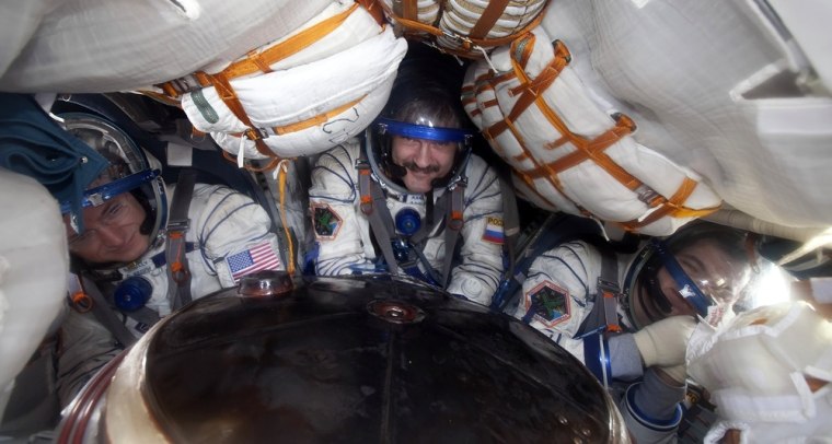 Image: Russian cosmonauts Oleg Skripochka (R),