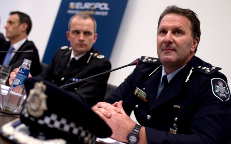 Image: Grant Edwards, Peter Davis and Rob Wainwright outline details of arrests during \"Operation Rescue\" linked to a global child abuse network during a news conference in The Hague