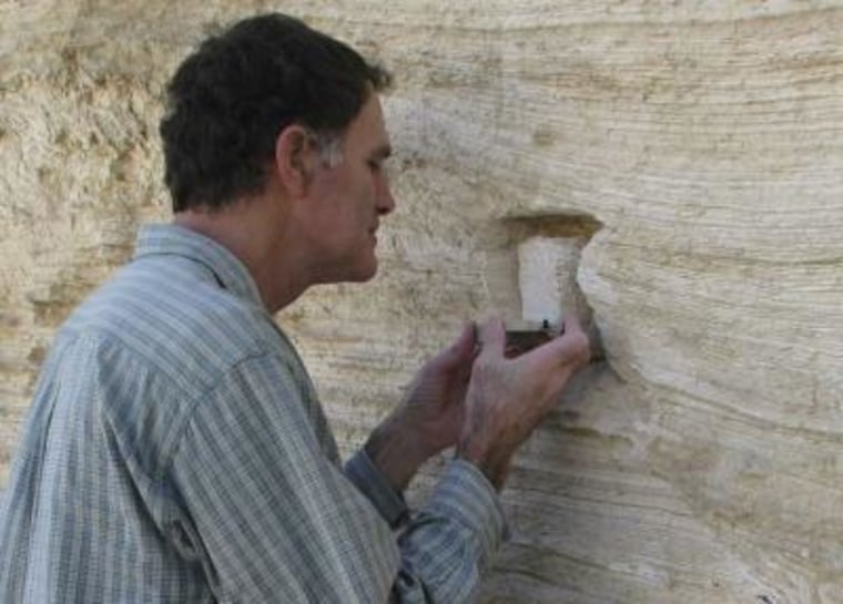 Shmuel Marco of Tel Aviv University examining rock patterns.