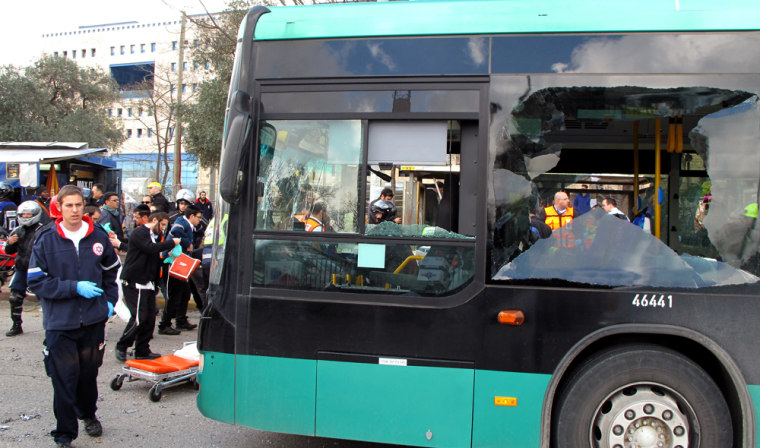 Image: Israeli paramedics and emergency services rush to the scene of a a massive bus explosion outside the Jerusalem's central bus station