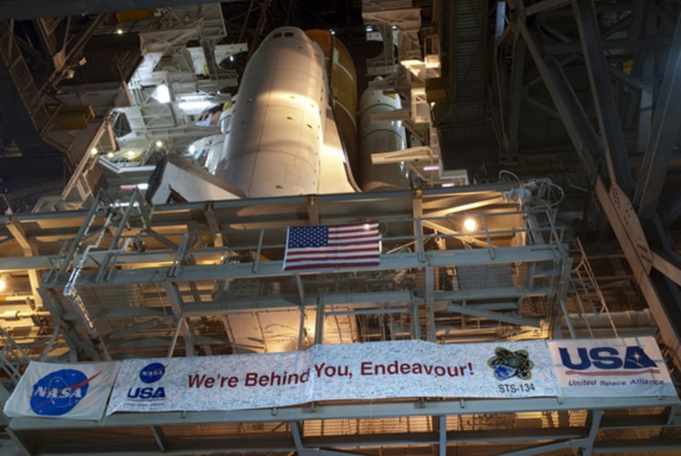 Space shuttle Endeavour is pictured during its slow move from High Bay 3 in the Vehicle Assembly Building to Launch Pad 39A at NASA's Kennedy Space Center in Florida.