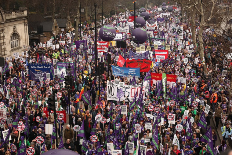 Image: A mass march in protest at government cuts sets off from Embankment in London