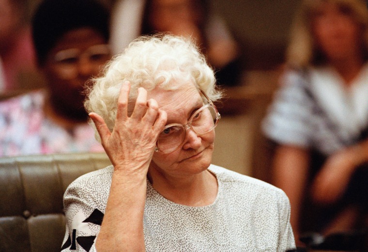 Image:  Dorothea Puente gestures as the verdict of guilty on two counts of first degree murder and one count of second degree murder is read against her in a coutroom in Monterey
