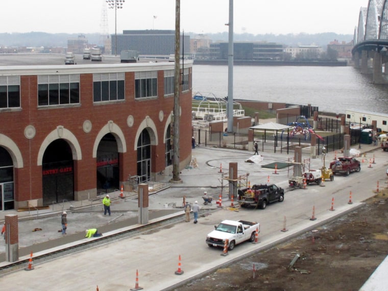 Image: Construction workers labor outside of Modern Woodmen Park in Davenport, Iowa