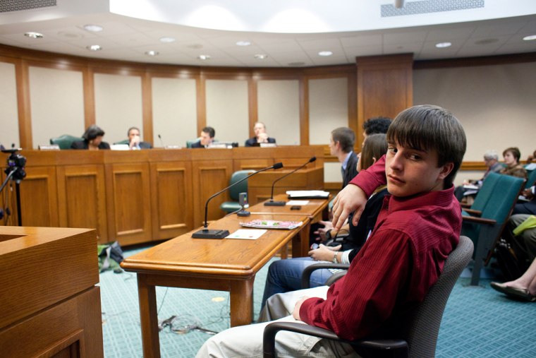 Image: Tyler Anastopoulos testifies during a state House committee meeting on abolishing corporal punishment at the State Capitol in Austin.