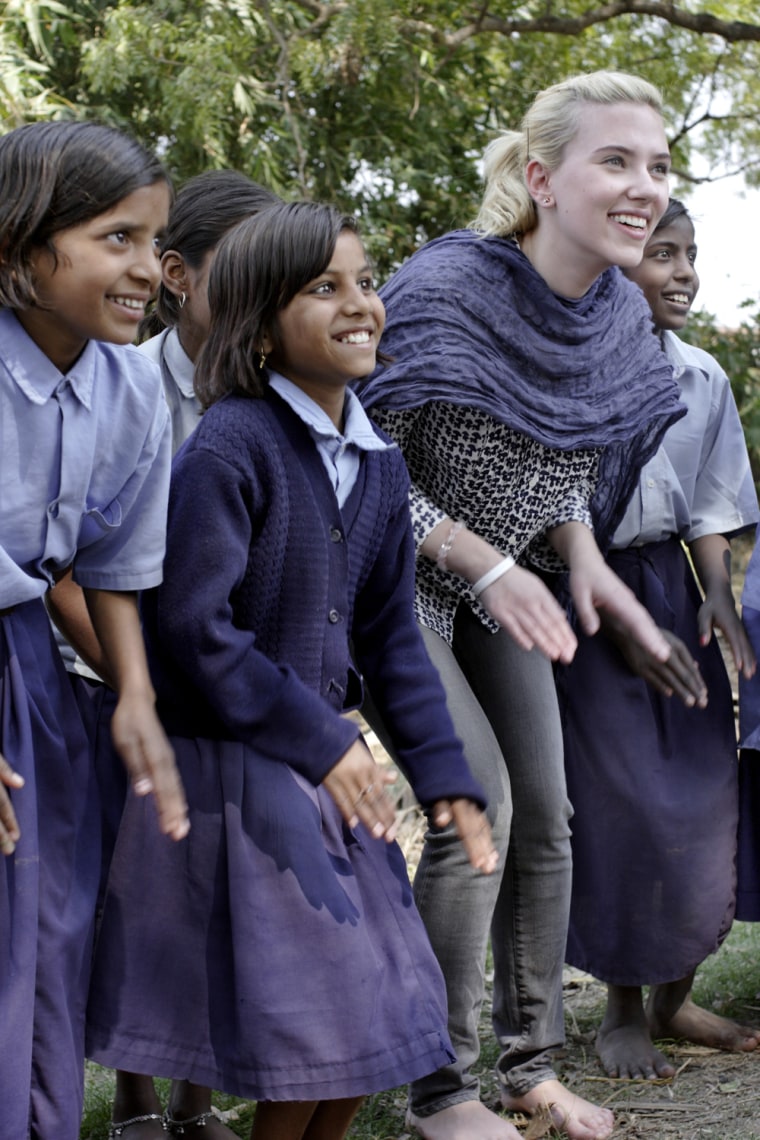 Scarlett Johansson with students a school for Dalit children in India. 