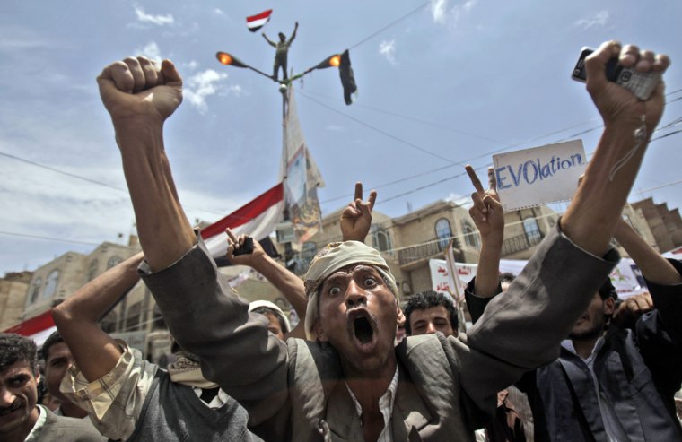 Image: An anti-government protestor, reacts during a demonstration demanding the resignation of  of Yemeni President Ali Abdullah Saleh, in Sanaa, Yemen