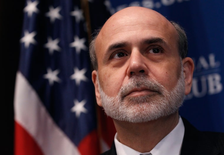 Image: Chairman of the Federal Reserve Ben Bernanke attends a National Press Club luncheon on the economic outlook in Washington