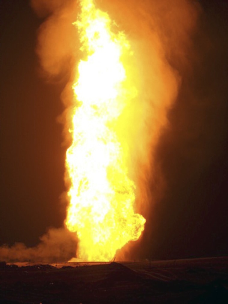 Image: Flames rise over the al-Sabil natural gas terminal after an explosion near the town of El-Arish, Egypt,.