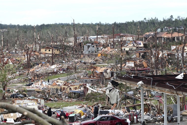 Image: Overnight tornadoes leaves part of Pratt City, a suburb of Birmingham, Alabama, in ruins