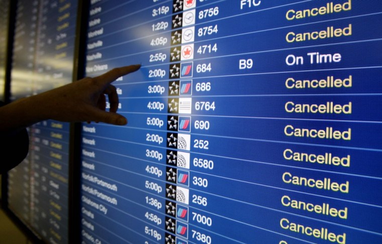 Image: A list of flight cancellations on an information screen