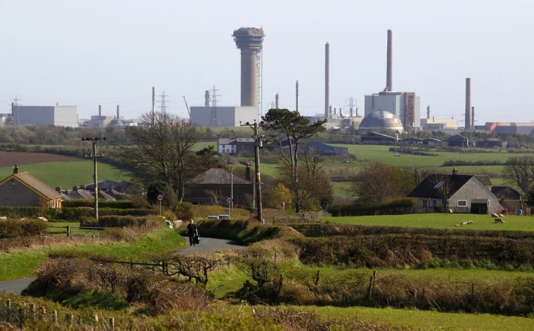Image: A man walks along a road near the Sellafield nuclear reprocessing site in Cumbria, England.