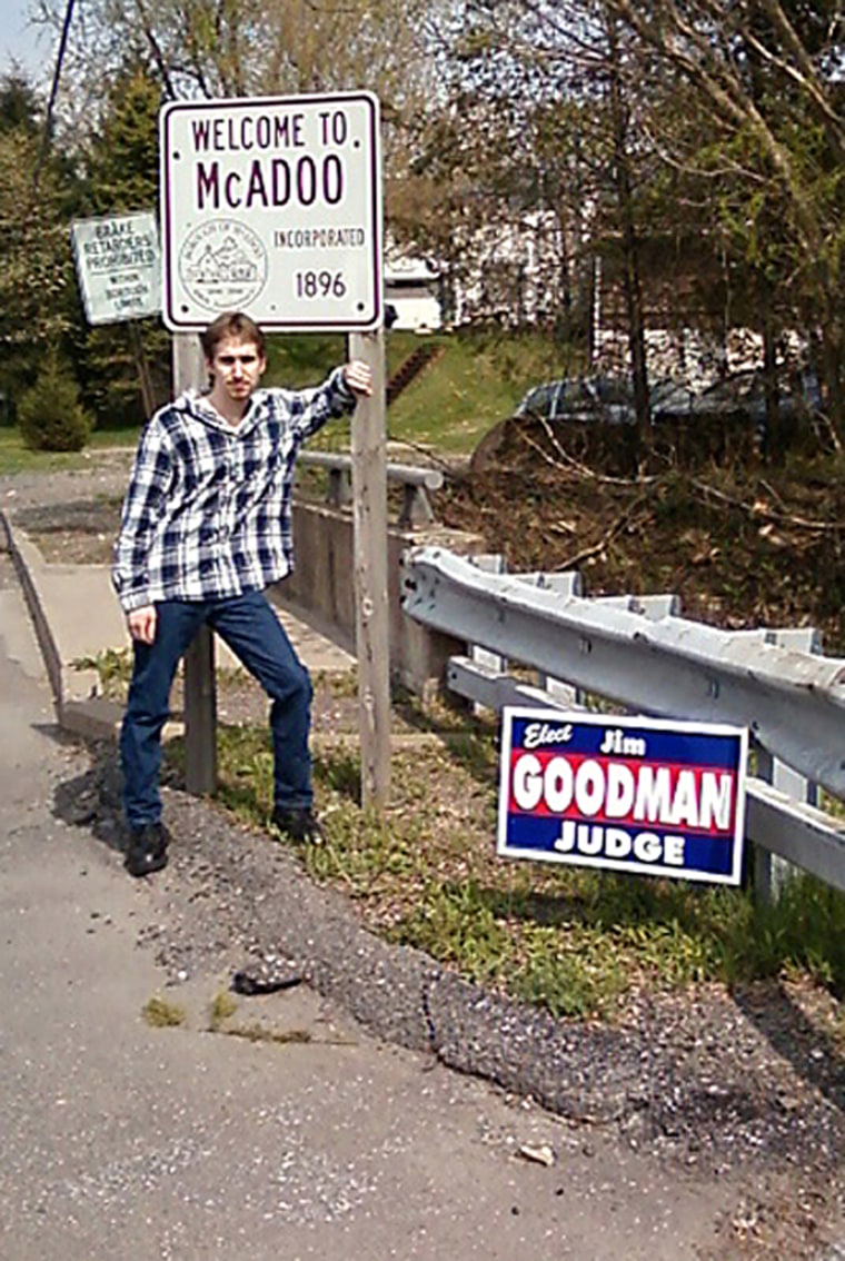 Image: Shawn Christy, a 19-year-old Pennsylvania man stands in front of a sign in his hometown of McAdoo, Pa.