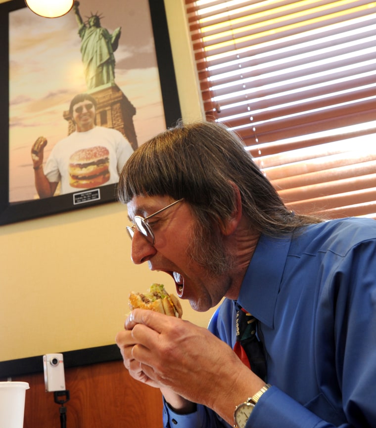 Image: Don Gorske, 59, a retired prison guard, eats his 25,000th Big Mac on Tuesday, May, 17.