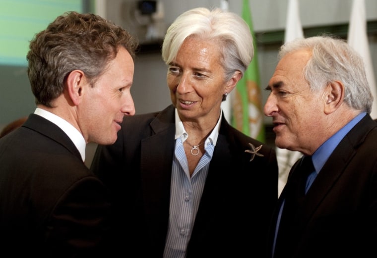 Image: US Treasury Secretary Timothy Geithner (L) speaks with French Finance Minister Christine Lagarde (C) and IMF Managing Director Dominique Strauss-Khan (R).
