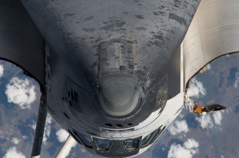 The nose, the forward underside and crew cabin of the space shuttle Endeavour approach first as the STS-134 vehicle prepares to dock with the International Space Station on May 18, 2011 (Flight Day 3). An Expedition 27 crew member took this photo at a distance of about 600 feet (180 meters).
