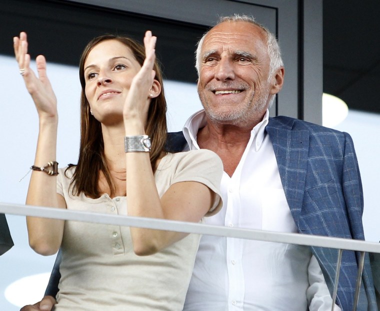 Image: Dietrich Mateschitz and an unidentified woman watch the opening of the \"Red Bull Ring\" motorsport race circuit in Spielberg