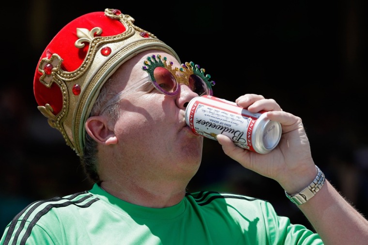 Image: Joe O'Dea drinks a beer before the 136th running of the Preakness Stakes  at Pimlico Race Course