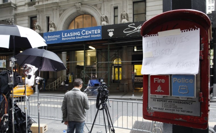 Image: A sign is pictured near the building where Dominique Strauss-Kahn is currently staying in, under house arrest, in New York