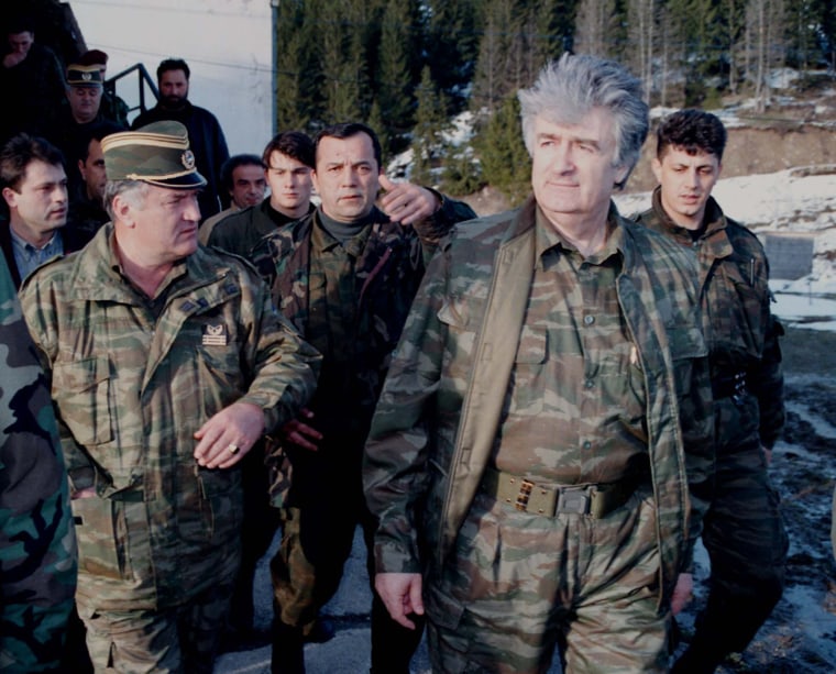 Image: Bosnian Serb wartime leader, Radovan Karadzic, second right, and his general Ratko Mladic, first left, in 1995.