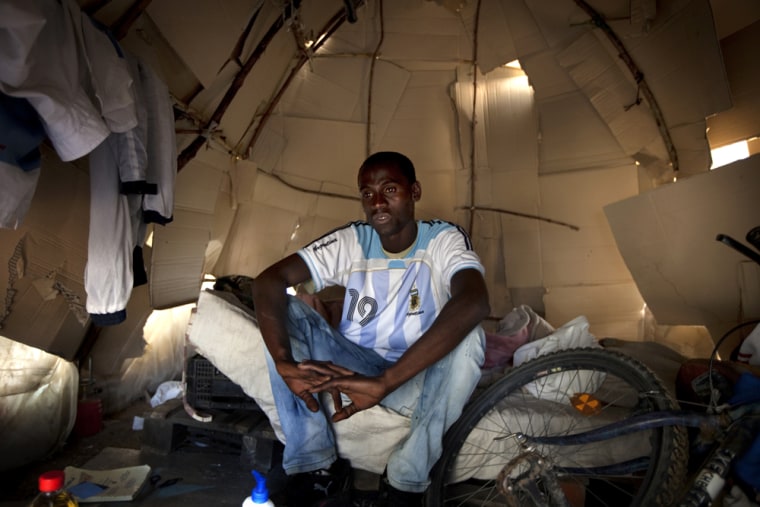 Image: Amadou Jallow, a Gambian immigrant, in a makeshift tent near Palos de la Frontera.