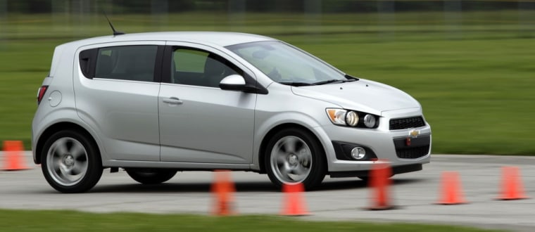 Image: Handout of a 2012 Chevrolet Sonic hatchback being driven around the track during a media engineering drive in Indianapolis