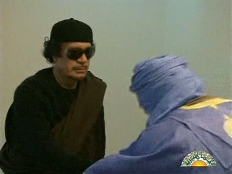 Image: Still image taken from footage broadcasted by Libyan state TV shows Muammar Gaddafi greeting a tribal leader in an unknown location
